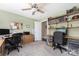 Functional office space with shelving, dual workstations, and carpeted floors at 1701 Truman Rd, Charlotte, NC 28205