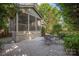 View of the patio, porch and lush landscaping enhance this home's outdoor appeal at 1701 Truman Rd, Charlotte, NC 28205