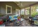 Cozy sunroom featuring wicker furniture and large windows offering serene views at 1701 Truman Rd, Charlotte, NC 28205
