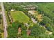 Aerial view of a large park. The park includes sports fields, tennis courts, walking paths and playgrounds at 18733 Bluff Point Rd, Cornelius, NC 28031