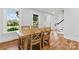 Charming dining room with wood table, chairs, and natural light at 18733 Bluff Point Rd, Cornelius, NC 28031