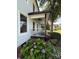 Charming front porch with rocking chairs and hydrangeas, offering a cozy and inviting entry at 18733 Bluff Point Rd, Cornelius, NC 28031