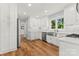 Spacious white kitchen with stainless steel appliances and a large sink at 18733 Bluff Point Rd, Cornelius, NC 28031