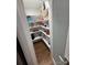 Walk-in pantry with ample shelving for organized storage of food and kitchen essentials at 18733 Bluff Point Rd, Cornelius, NC 28031