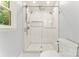 Luxurious walk-in shower with multiple shower heads and modern tile work at 18733 Bluff Point Rd, Cornelius, NC 28031