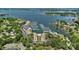 Stunning aerial view of community, showcasing marina, pool, and lush landscaping at 18853 Vineyard Point Ln, Cornelius, NC 28031