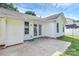 Backyard patio, white vinyl siding, french doors, and manicured lawn at 1922 Decatur Ct, Charlotte, NC 28213