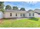 A long green lawn, white vinyl siding, and manicured lawn at 1922 Decatur Ct, Charlotte, NC 28213