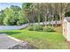 A long green lawn, white vinyl fence, and mature trees at 1922 Decatur Ct, Charlotte, NC 28213