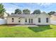 A long green lawn, white vinyl siding, and manicured lawn at 1922 Decatur Ct, Charlotte, NC 28213