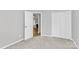 Another bedroom view, focusing on the open doorway, closet, and connection to other living spaces at 1922 Decatur Ct, Charlotte, NC 28213