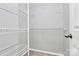 Walk-in closet equipped with shelving and carpeted flooring for optimal storage solutions at 1922 Decatur Ct, Charlotte, NC 28213