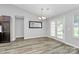 The dining room boasts wood-look laminate flooring, chandelier lighting, and sliding glass doors to the exterior at 1922 Decatur Ct, Charlotte, NC 28213