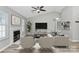 Inviting living room offers a fireplace, vaulted ceiling, neutral color palette and modern furnishings at 1922 Decatur Ct, Charlotte, NC 28213