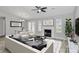 Cozy living room with a fireplace, and adjacent dining area filled with light at 1922 Decatur Ct, Charlotte, NC 28213