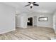 Living room with modern gray flooring, neutral paint, and bright and open floorplan at 1922 Decatur Ct, Charlotte, NC 28213