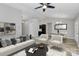 Spacious living room with sleek furniture, modern decor, and neutral colors and dining area at 1922 Decatur Ct, Charlotte, NC 28213