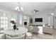 Modern living room and dining area features ample seating and lots of natural light at 1922 Decatur Ct, Charlotte, NC 28213