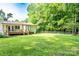 Spacious backyard with a wooden deck, perfect for outdoor entertaining and relaxation at 214 Cottage Pl, York, SC 29745