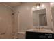 Bathroom featuring a shower-tub combo and a vanity with marble countertop at 214 Cottage Pl, York, SC 29745