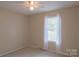 Neutral bedroom with carpet flooring, window and a ceiling fan with light at 214 Cottage Pl, York, SC 29745