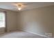 Simple bedroom with carpet flooring, window and a ceiling fan with light fixture at 214 Cottage Pl, York, SC 29745