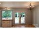 Bright dining room with backyard views through French doors from the kitchen area at 214 Cottage Pl, York, SC 29745