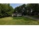 Well-maintained lawn and cozy home with a long driveway in a wooded area at 214 Cottage Pl, York, SC 29745