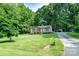 Charming single-story home with a brick facade and a well-manicured lawn at 214 Cottage Pl, York, SC 29745