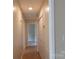 Well-lit hallway with hardwood flooring, closet and views of other rooms at 214 Cottage Pl, York, SC 29745