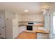 Functional kitchen with white cabinets and wood countertops, offering a cozy and practical cooking area at 214 Cottage Pl, York, SC 29745