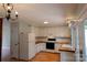 Efficient kitchen with white cabinets and wood countertops, offering a practical cooking environment at 214 Cottage Pl, York, SC 29745
