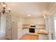 Charming kitchen with white cabinetry and wood countertops, providing a clean and inviting space at 214 Cottage Pl, York, SC 29745