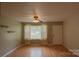 Bright living room with ample natural light, wood floors, and neutral walls creating a welcoming space at 214 Cottage Pl, York, SC 29745