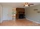 Inviting living room with a cozy fireplace and wood floors, creating a warm atmosphere at 214 Cottage Pl, York, SC 29745