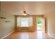 Well-lit living room featuring wood floors and a neutral color palette, offering a versatile space at 214 Cottage Pl, York, SC 29745