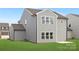 Exterior of the home showing the backyard with gray siding and neatly manicured lawn at 219 Redondo Dr # 65, Wingate, NC 28174