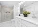 A bright bathroom featuring double sinks, a glass door shower, and sleek fixtures at 219 Redondo Dr # 65, Wingate, NC 28174