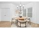 Chic dining area with a round table, modern chandelier, and large window providing ample natural light at 219 Redondo Dr # 65, Wingate, NC 28174