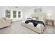 Serene main bedroom with plush carpeting, and large windows offering a peaceful retreat at 219 Redondo Dr # 65, Wingate, NC 28174