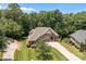 Aerial view showcasing the lush landscaping, large driveway, and the home's architectural design at 2341 Shiny Leaf Dr, Denver, NC 28037