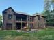 Brick home featuring a second-story deck with large windows at 2341 Shiny Leaf Dr, Denver, NC 28037