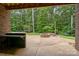 An outdoor kitchen is on the back patio with a built-in counter and stonework design at 2341 Shiny Leaf Dr, Denver, NC 28037