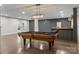 Finished basement features a classic pool table with elegant lighting above and a built-in bar at 2341 Shiny Leaf Dr, Denver, NC 28037