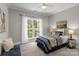Comfortable bedroom featuring natural light and football decor at 2341 Shiny Leaf Dr, Denver, NC 28037