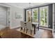 Dining room with wood floors, decorative light fixture and views of backyard at 2341 Shiny Leaf Dr, Denver, NC 28037