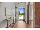 Bright foyer with wood floors, decorative table, and an exterior view at 2341 Shiny Leaf Dr, Denver, NC 28037