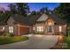 Charming brick home showcasing a well-manicured lawn and a side-entry garage at 2341 Shiny Leaf Dr, Denver, NC 28037