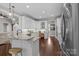 Bright kitchen boasts white cabinets, granite countertops, stainless appliances, and eat in breakfast bar at 2341 Shiny Leaf Dr, Denver, NC 28037