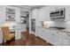 Bright kitchen area featuring white cabinets, stainless appliances, and desk nook area at 2341 Shiny Leaf Dr, Denver, NC 28037